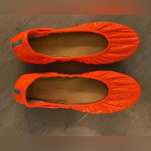 Gently used pair of outrageous orange tieks